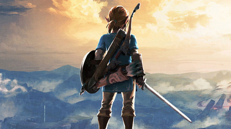 Link surveys the sun rising over Hyrule on the cover art for The Legend of Zelda: Breath of the Wild
