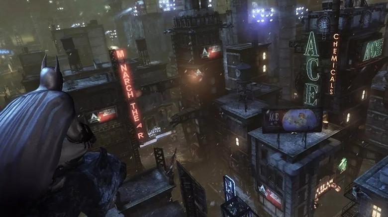 Batman overlooks the cityscape at night in Batman: Arkham City