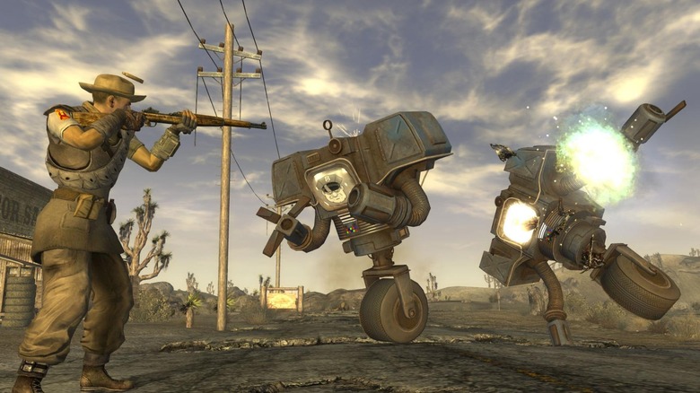 A Fallout: New Vegas taking fire at two robots in the street