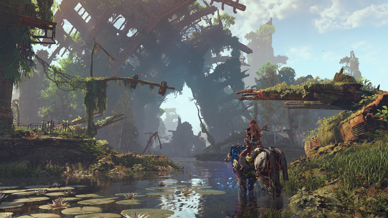 Aloy in Horizon Zero Dawn riding a mechanical horse looking at a ruined building