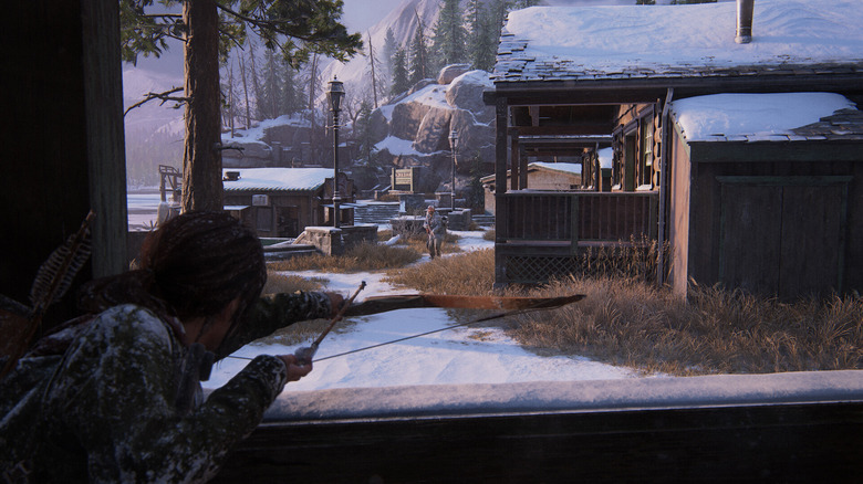Ellie shooting a bow and arrow at a zombie in The Last of Us