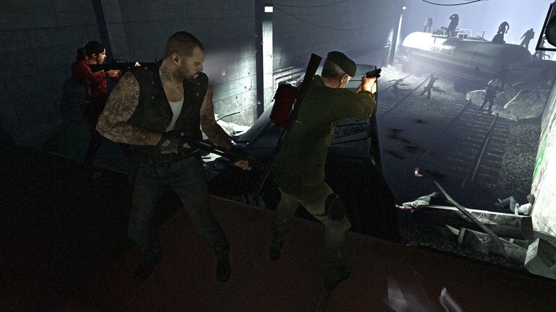 The survivors fire at a group of incoming zombies in Left 4 Dead