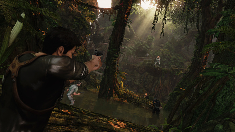 Nathan Drake aims a pistol at a gunman in a jungle in Uncharted 2: Among Thieves