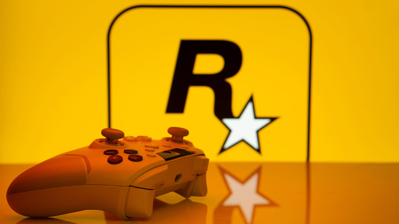 A controller sits in front of the Rockstar Games logo