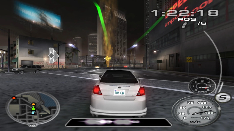 A car speeds through a city at night in Midnight Club 3: Dub Edition (2005)