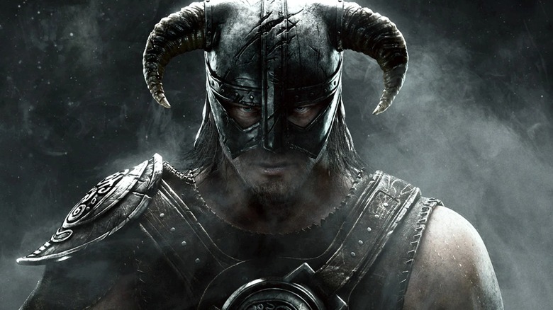 A warrior stands in a horned helmet in promotional artwork for The Elder Scrolls V: Skyrim