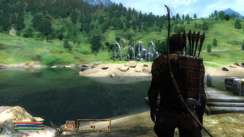 An archer overlooks ruins by a river in The Elder Scrolls IV: Oblivion