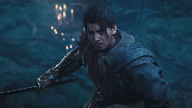 Miyamoto Musashi looks up while holding his katana in Onimusha: Way of the Sword