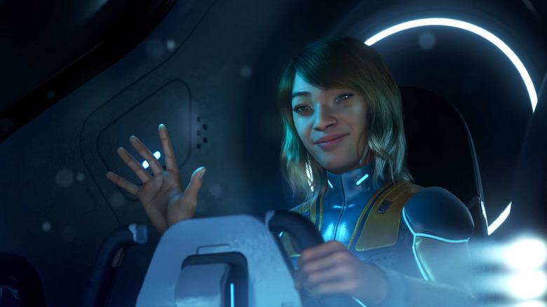 A woman waves while piloting a submarine in Subnautica 2