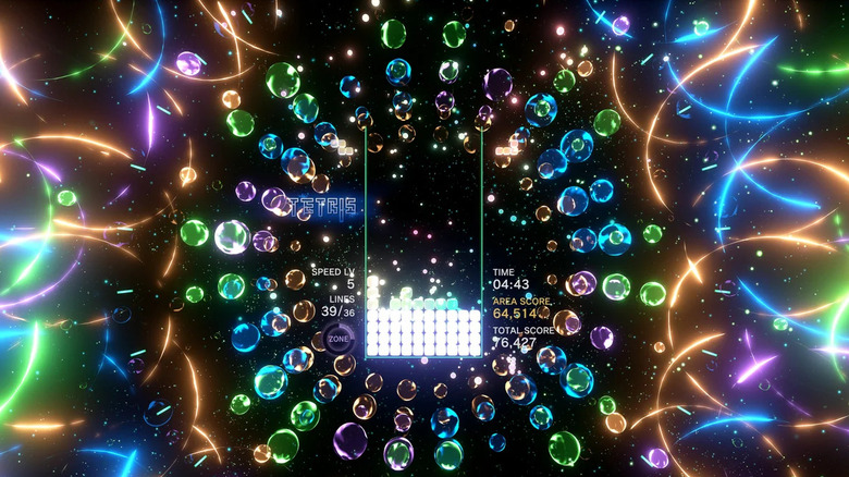 Tetris is played in a kaleidoscope of lights and glowing shapes in Tetris Effect