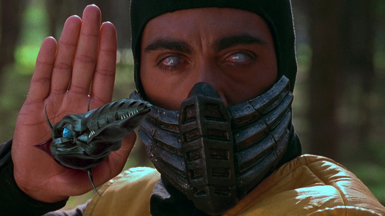 A spear emerges from Scorpion's palm in Mortal Kombat (1995)