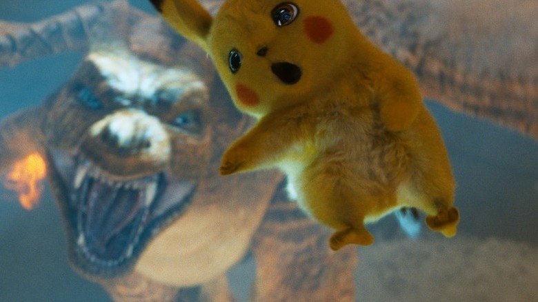 Pikachu falls near a snarling Charizard in Pokémon: Detective Pikachu