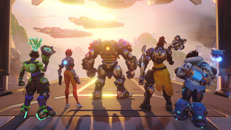 A group of futuristic soldiers look at hovering ships at sunset in Overwatch 2