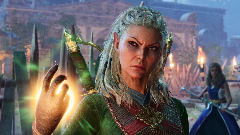 Jaheira lies up her right hand with magic in Baldur's Gate III