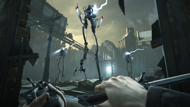 A Dishonored player stealthily moving around large robots on the ground