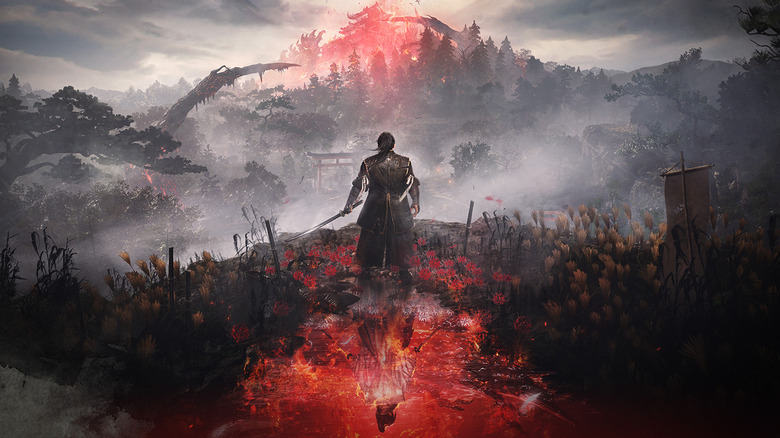 Tokugawa Takechiyo approaches a castle in a forest glowing with red energy in Nioh 3