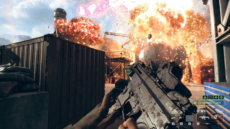 The player holding a machine gun as an explosion goes off in Battlefield 6
