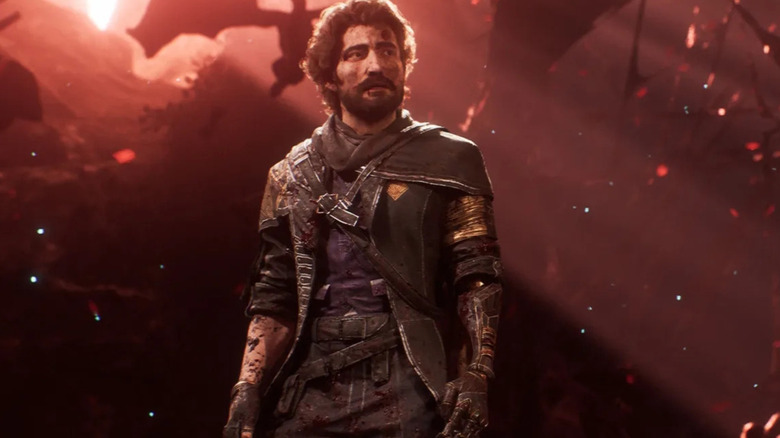 Gustave stands in a darkened area in Clair Obscur: Expedition 33