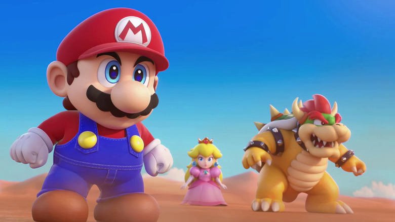 Mario, Peach, and Bowser stand in a desert in Super Mario RPG