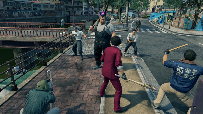 Ichiban Kasuga and his friends confront a rival gang on a bridge in Yakuza: Like a Dragon