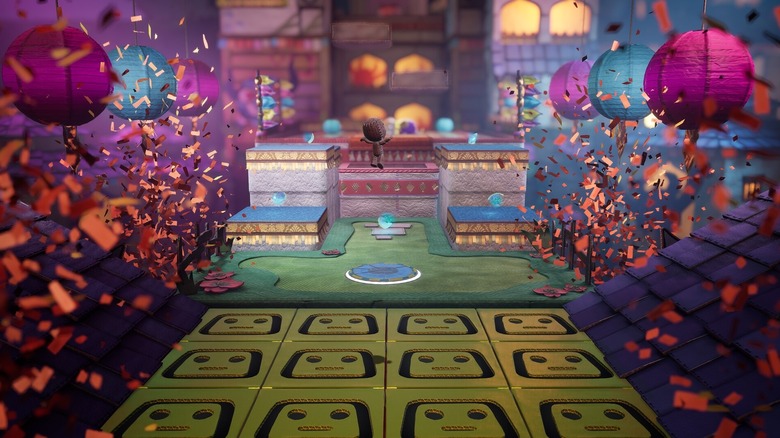 Sackboy jumps above a confetti-filled field in Sackboy: A Big Adventure