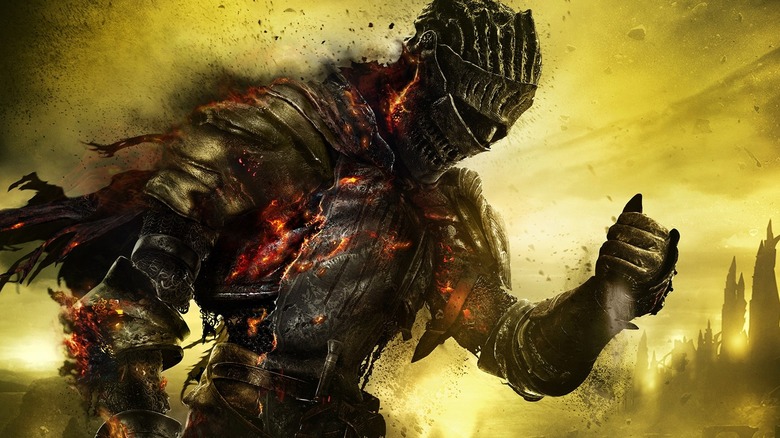 A knight burns away on the cover art for Dark Souls III