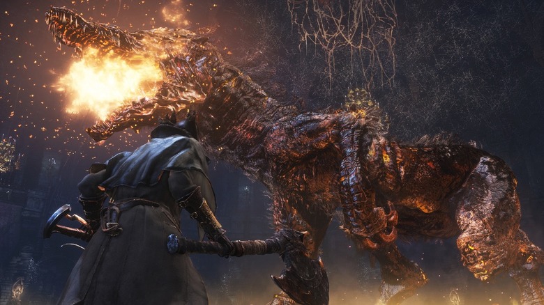 The Hunter faces a flaming monster in Bloodborne