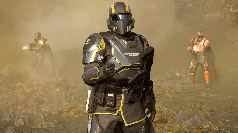 Three shock troppers stand in a hazy environment in Helldivers II