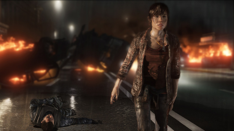 Jodie Holmes walks away from burning car crashes on a rainy street in Beyond: Two Souls