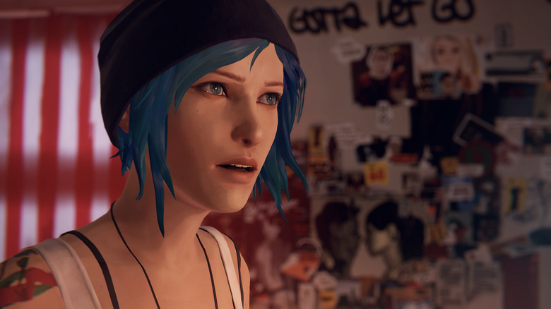 Chloe Price stands in front of a wall of pictures in Life Is Strange