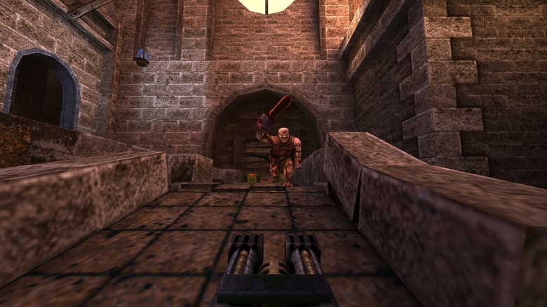 The Ranger aims a twin-barreled gun at a charging enemy in Quake