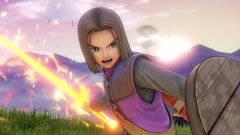 Hero shouts while holding a shield and glowing sword in Dragon Quest XI