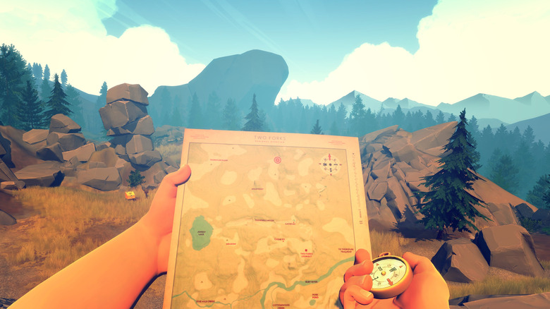 The player checking a map and compass in Firewatch