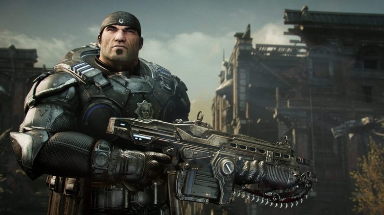 Marcus Fenix holds an assault rifle in Gears of War: Reloaded