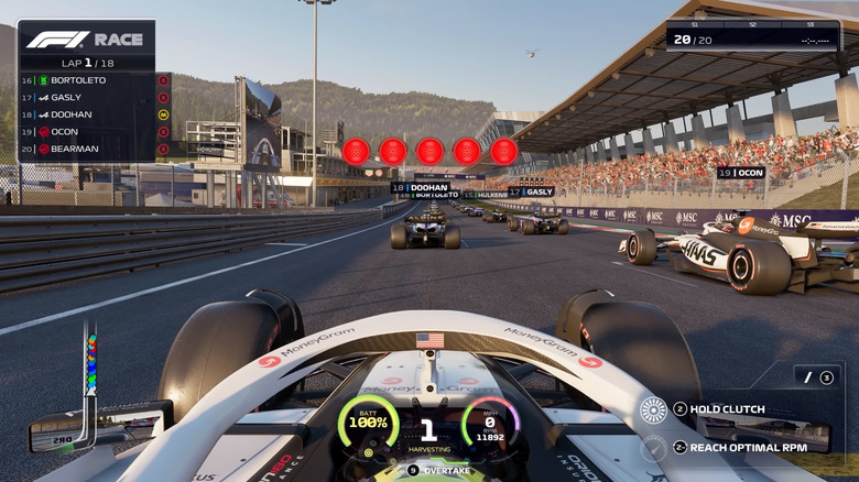 A first-person view from inside a Formula One car on the starting grid in F1 25