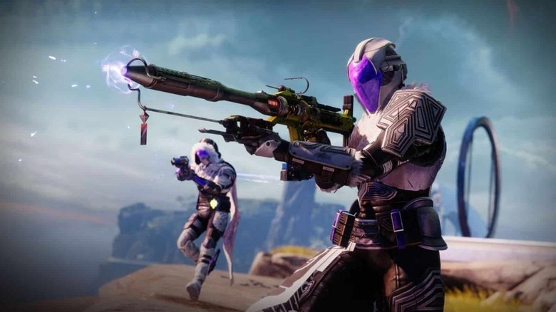 Two soldiers aim futuristic weapons in Destiny 2