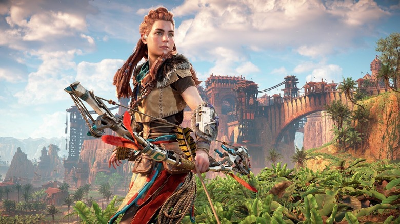 Aloy holds a bow in front of a jungle on the cover art for the remastered edition of Horizon Zero Dawn