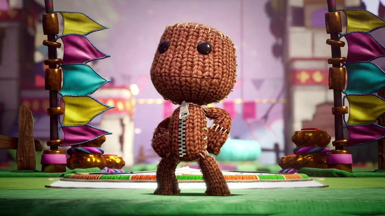 Sackboy poses triumphantly in Sackboy: A Big Adventure