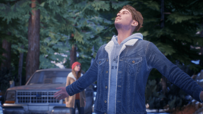 Tyler Ronan stands with his arms outstretched outside in Tell Me Why