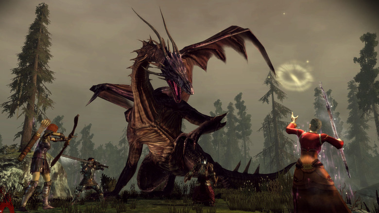 Several Dragon Age: Origins players attacking a dragon