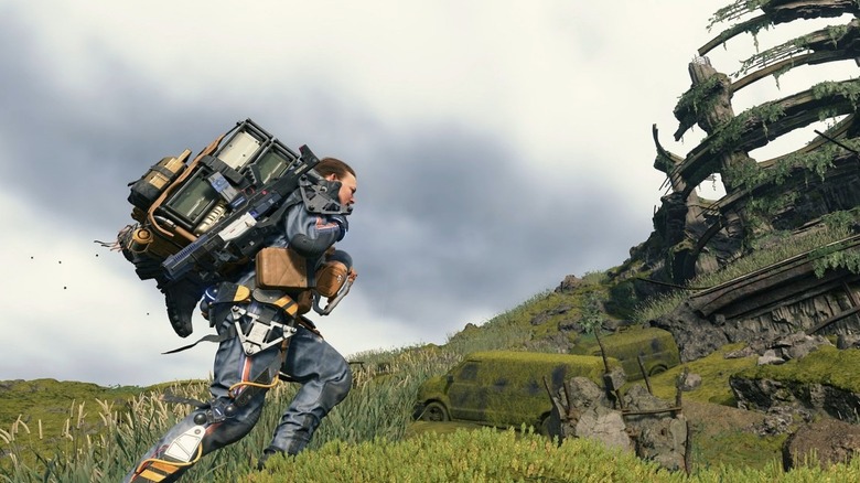 Sam Porter Bridges runs by an overgrown parking structure in Death Stranding