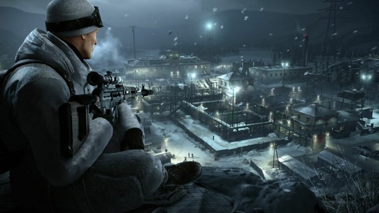 Agent 47 surveys a Siberian prison with a sniper rifle in Hitman: World of Assassination