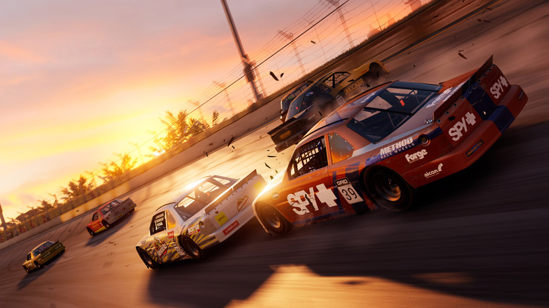 Sports cars race along a track's curve during sunset in Grid Legends