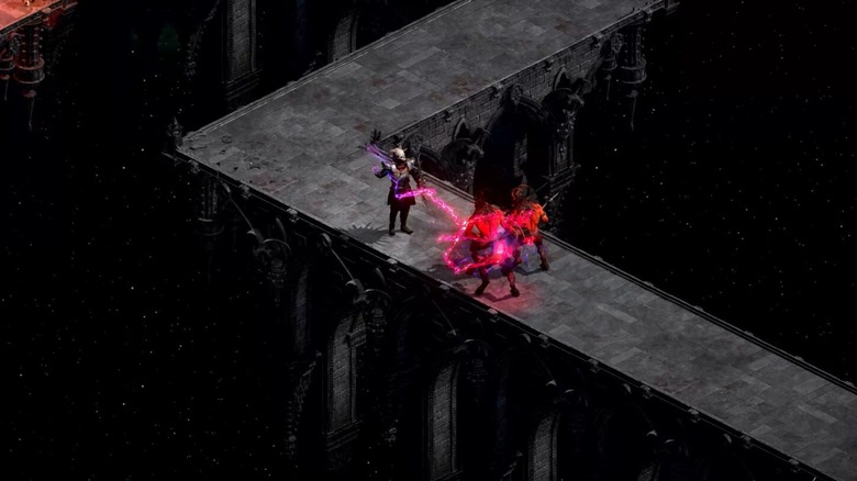 A warlock casts a spell on two enemies in Diablo II: Resurrected