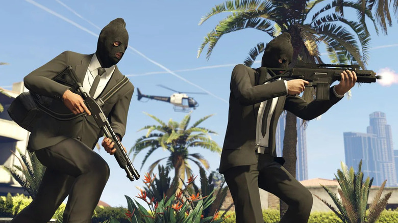 Two masked robbers run with guns in Grand Theft Auto Online