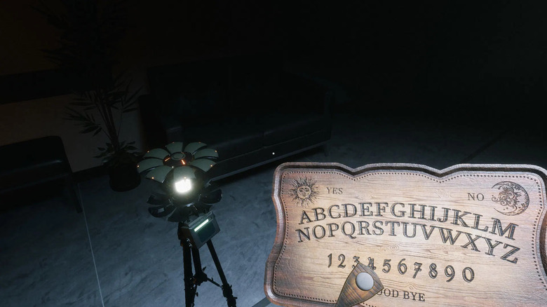 A player character uses a Ouija board by a ghost detector in Ghost Watchers
