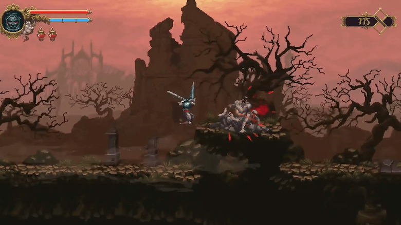 The Penitent One lunges at a monster in an abandoned graveyard in Blasphemous