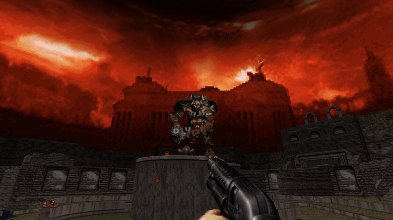Duke Nukem aims a shotgun at an armored monster in Duke Nukem 3D