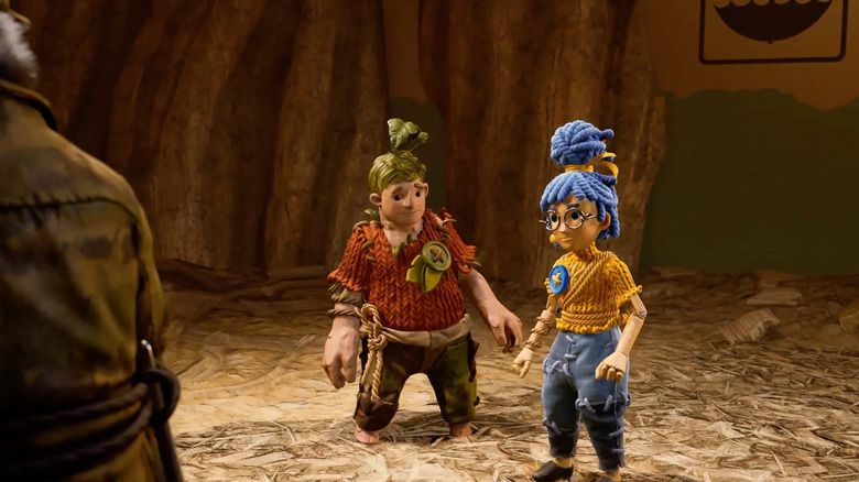 Cody and May stand together in doll form in It Takes Two