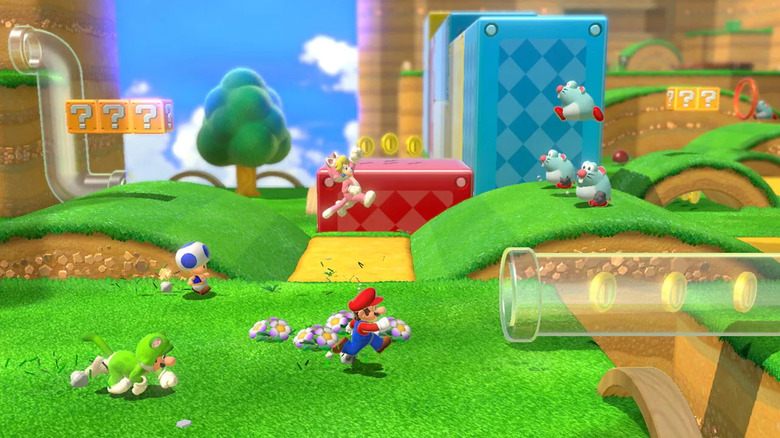 Mario, Peach, Toad, and Luigi run towards a warp pipe in Super Mario 3D World